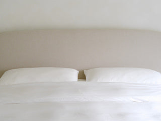Made bed with smooth eucalyptus lyocell pillowcases, the best pillowcase surface for hair