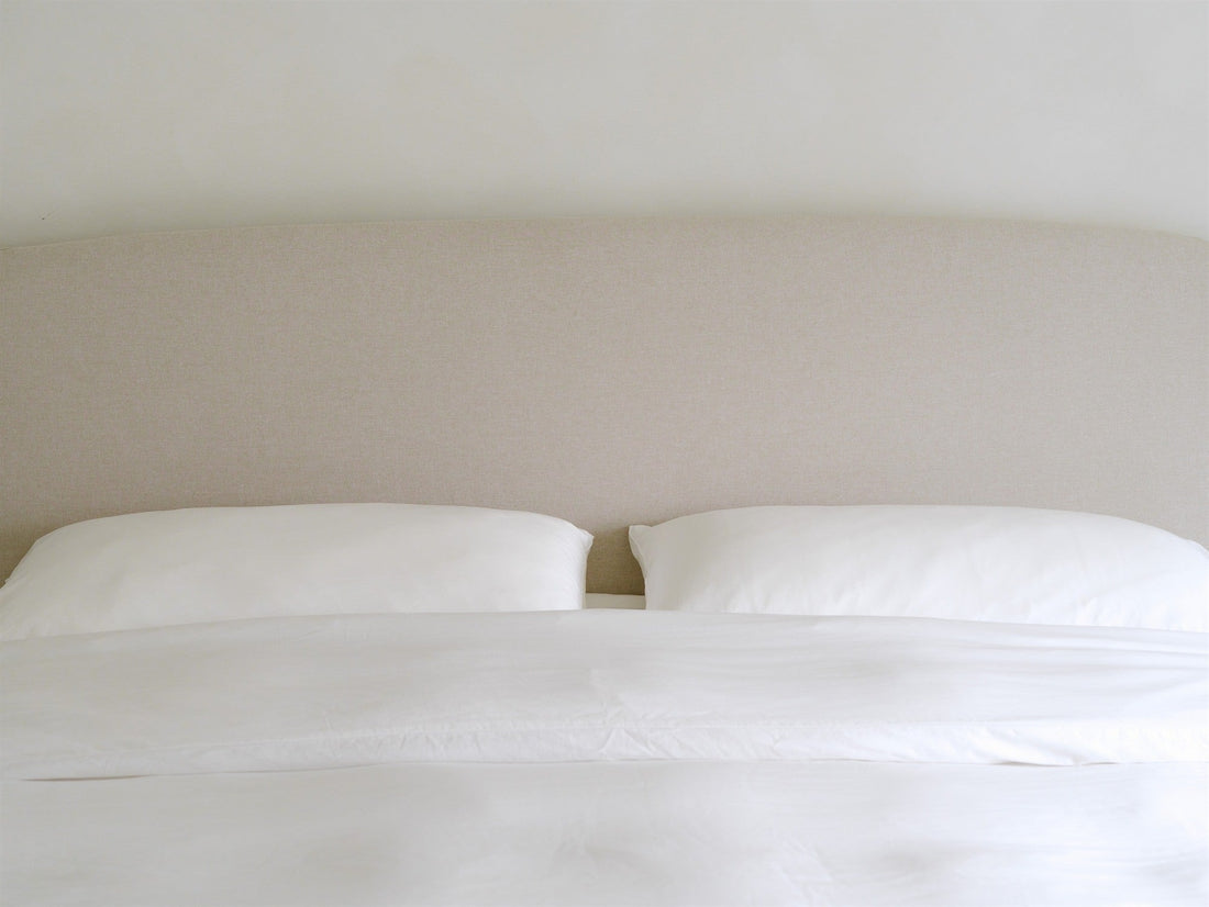 Made bed with smooth eucalyptus lyocell pillowcases, the best pillowcase surface for hair