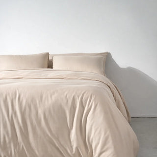 A bed made up with a Soft Cashmere eucalyptus lyocell duvet cover, the washable outer layer of a duvet system