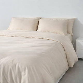 Bed dressed in a Soft Cashmere eucalyptus lyocell duvet cover and pillowcases, the washable outer layer that separates a duvet system from a comforter