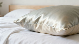 A close-up of a luxurious smooth eucalyptus fabric pillowcase, reflecting a clean and calming bedroom environment, high quality photography style.