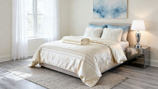 A clean, modern bedroom featuring Dreamey CloudThera bedding in Soft Cashmere, highlighting the premium sateen texture.