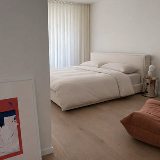 A calm bedroom with a bed made up in Soft Cashmere eucalyptus lyocell bedding, the surface the neck and chest press against overnight