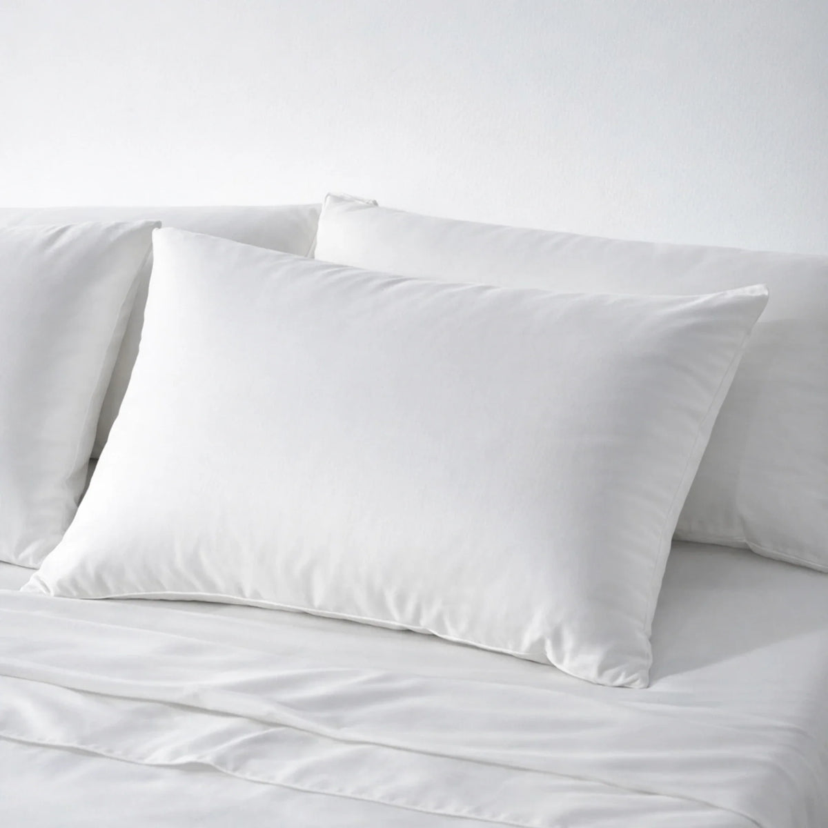 Minimalist bedroom styled with the Buttercream eucalyptus Complete Sleep set by a window